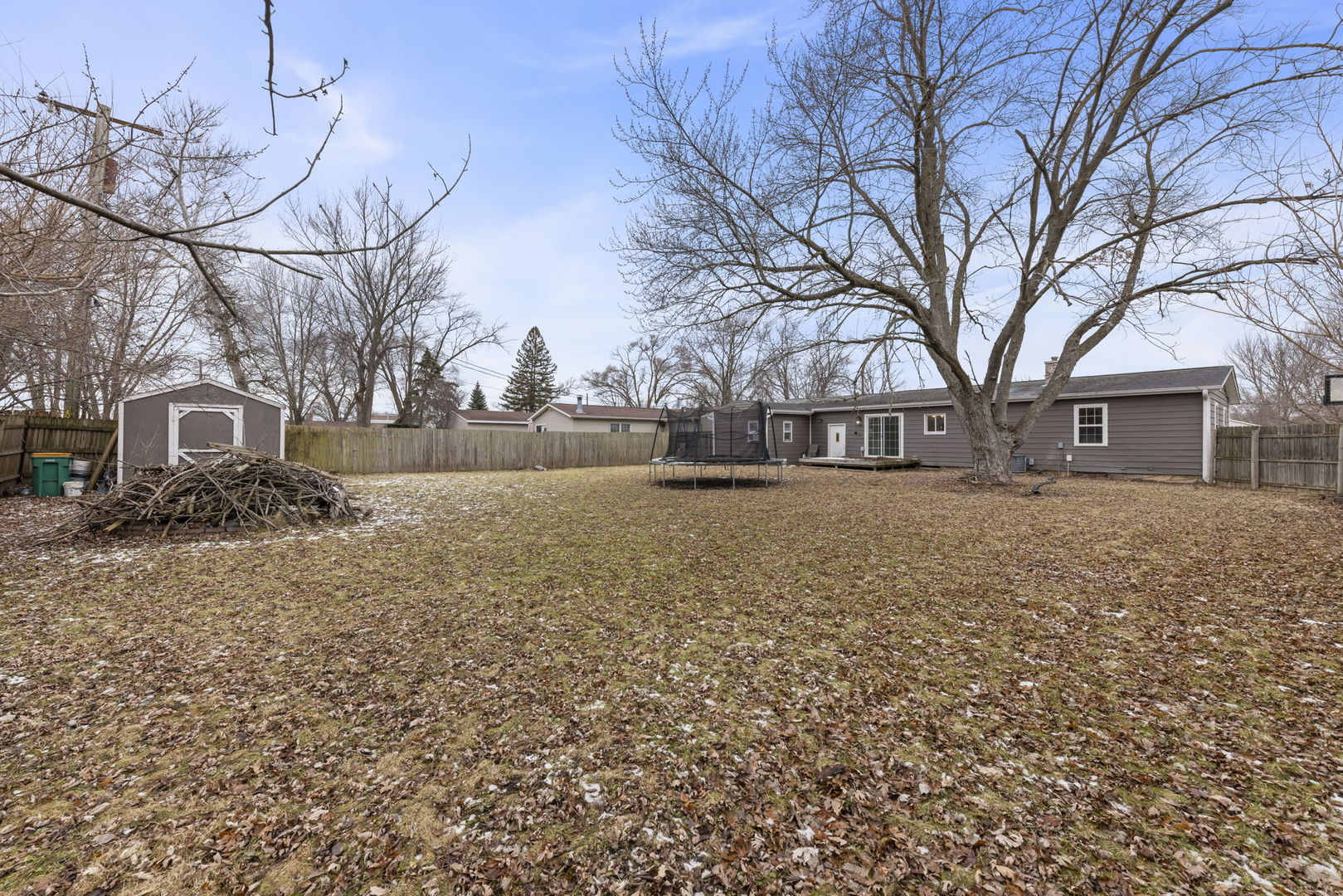 422 Best Avenue DeKalb, IL 60115 - Photo 24 of 34 a front view of a house with a yard covered with snow