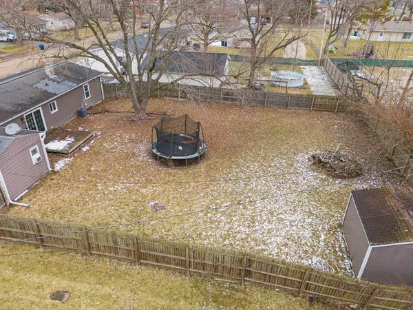 a view of a backyard of the house