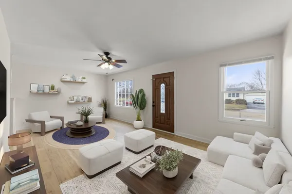 a living room with furniture and a large window