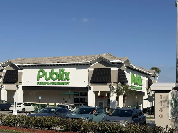 a view of a building with a yard