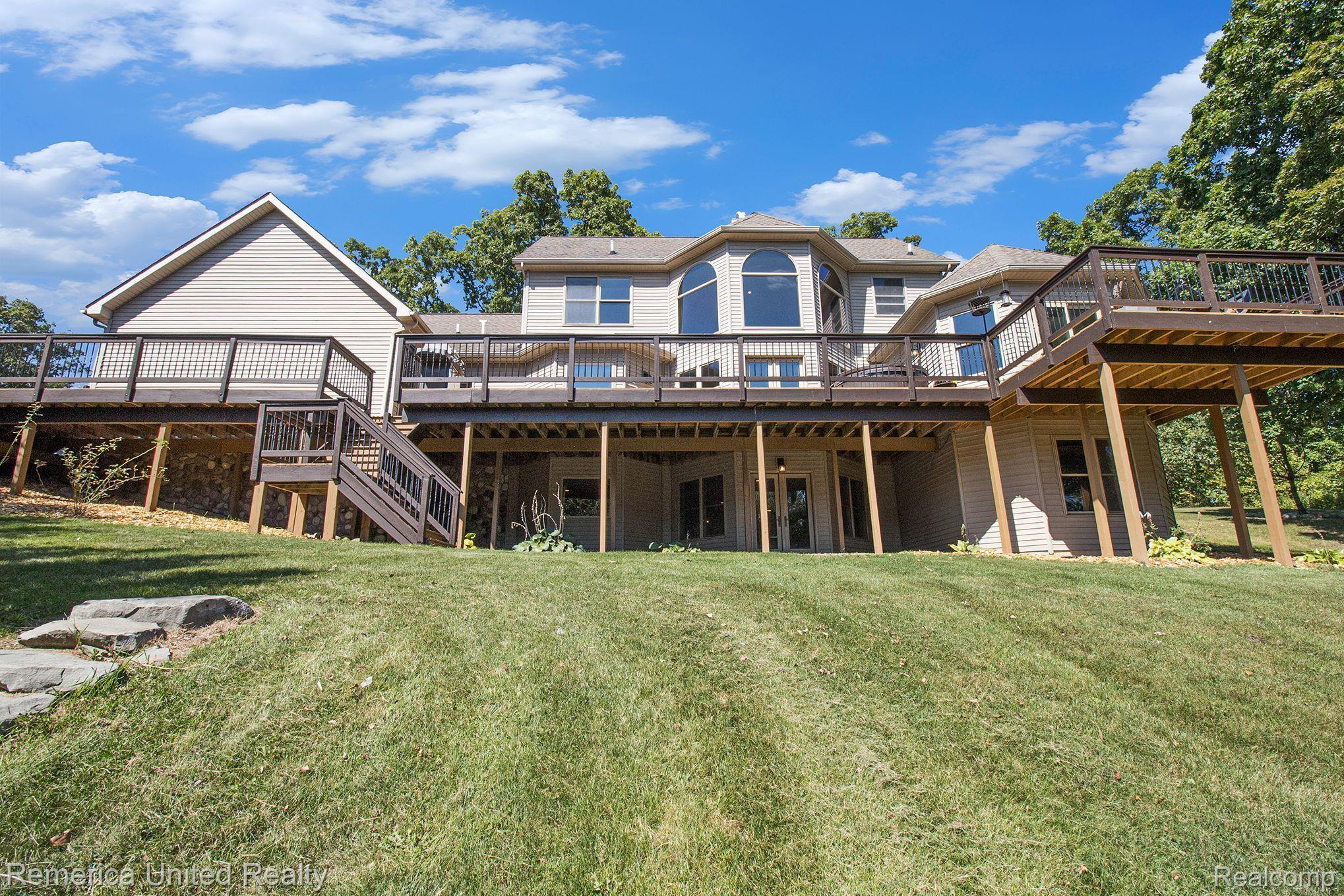 3470 East Highland Road Howell, MI 48843 - Photo 64 of 66 Back of House & Walkout