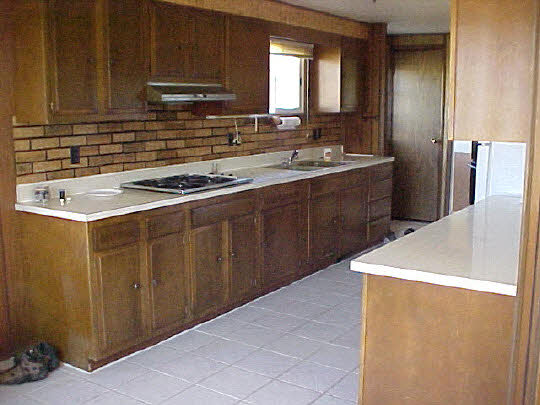 2719 South Snyder Road Oregon, IL 61061 - Photo 1 of 5 a kitchen with a sink a stove and cabinets