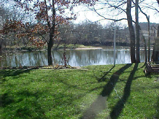 2719 South Snyder Road Oregon, IL 61061 - Photo 5 of 5 a view of a lake with a yard and large trees