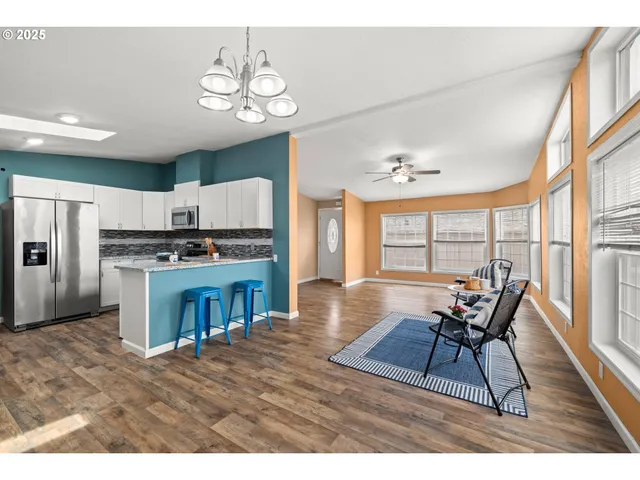 a view of a dining room with furniture window and wooden floor