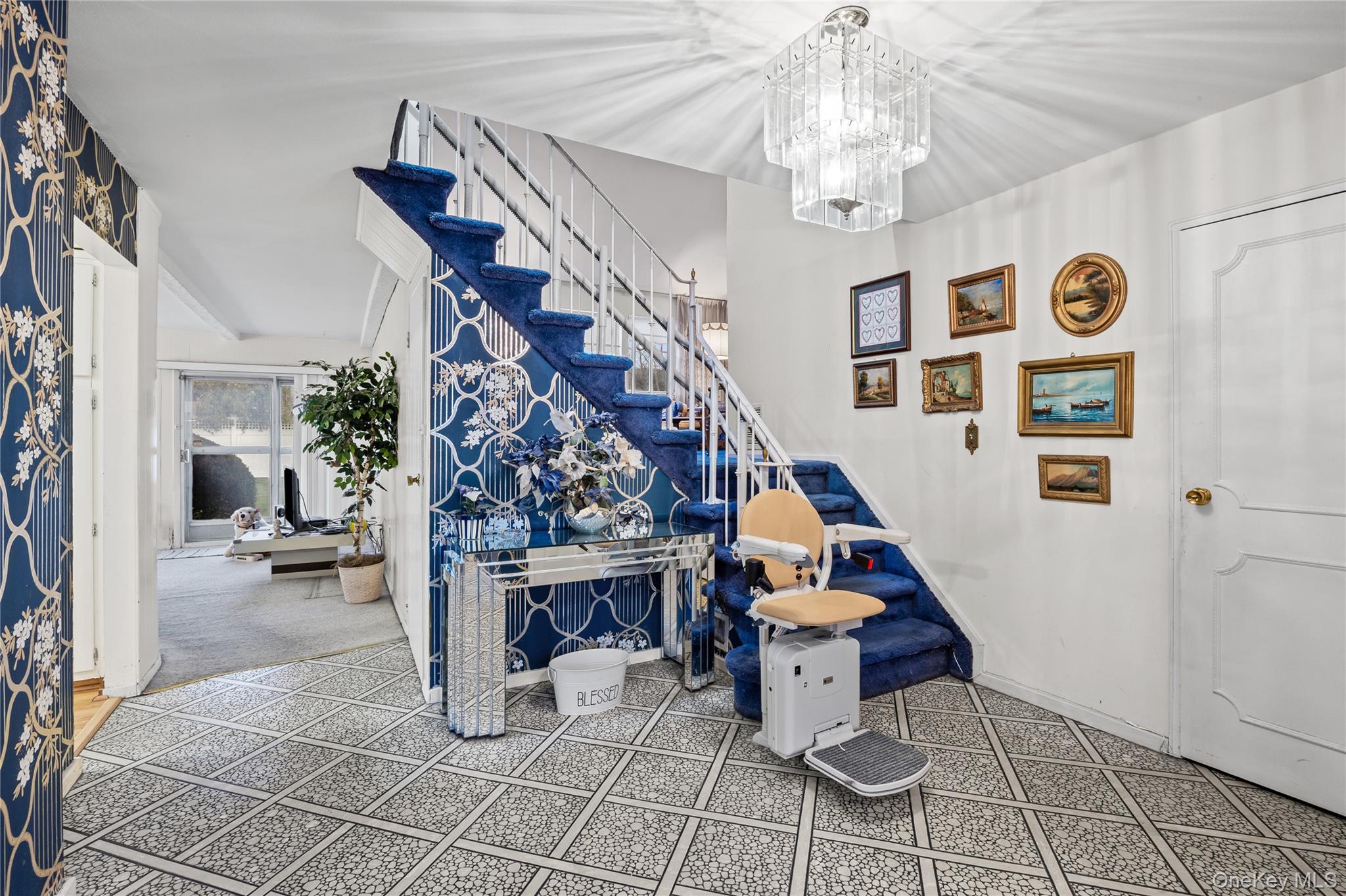 2929 Mandalay Beach Road Wantagh, NY 11793 - Photo 12 of 26 a room with lots of white furniture and chandelier