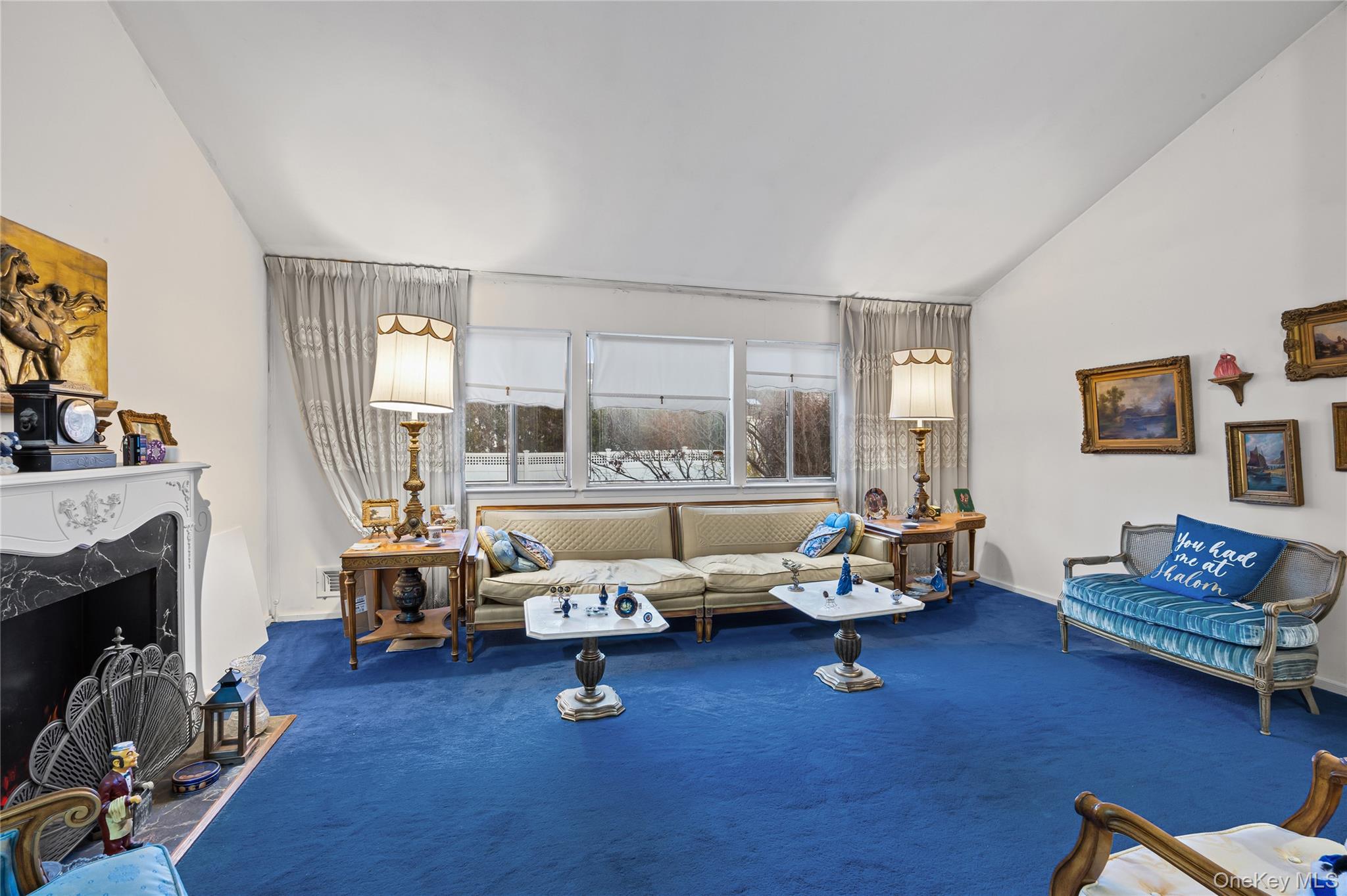 2929 Mandalay Beach Road Wantagh, NY 11793 - Photo 13 of 26 a living room with furniture and a fireplace