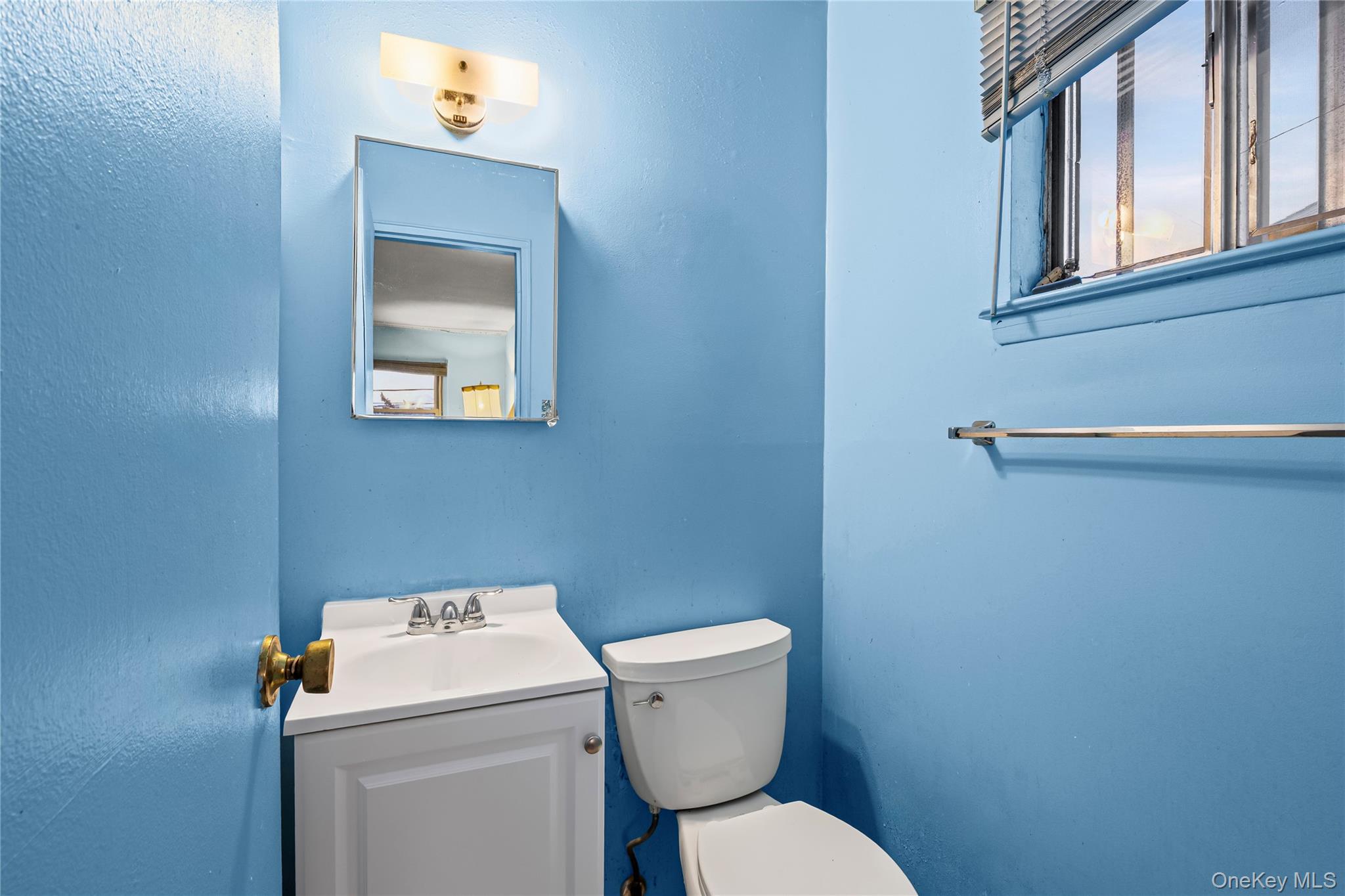 2929 Mandalay Beach Road Wantagh, NY 11793 - Photo 17 of 26 a bathroom with a toilet and a sink