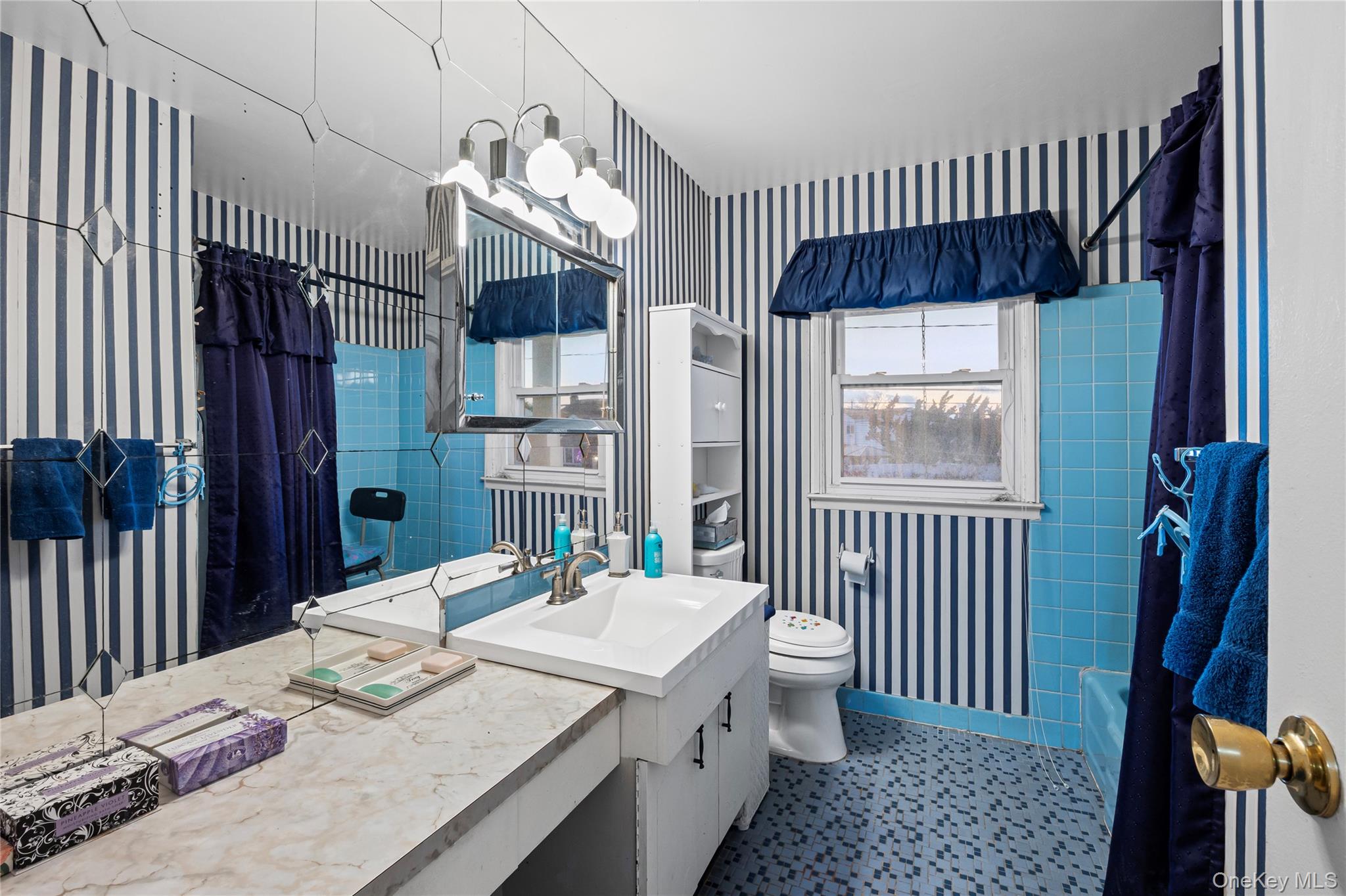 2929 Mandalay Beach Road Wantagh, NY 11793 - Photo 18 of 26 a kitchen with a table and chairs