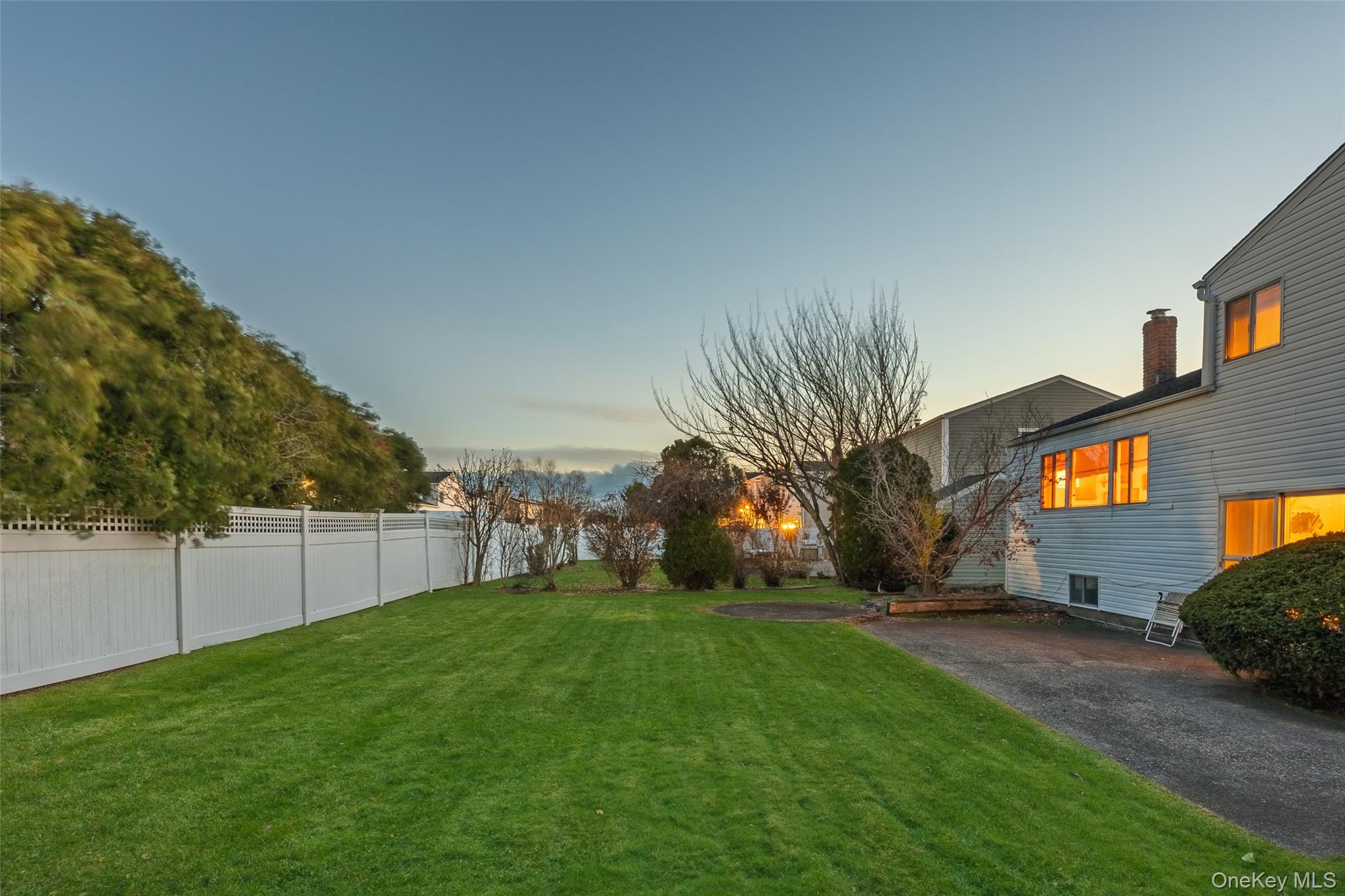 2929 Mandalay Beach Road Wantagh, NY 11793 - Photo 22 of 26 a view of a backyard with a garden and plants