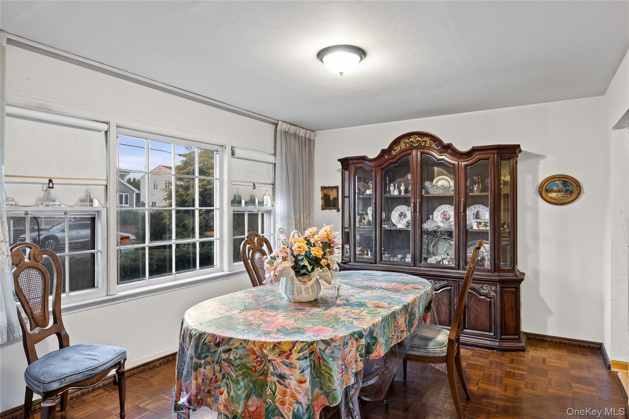 2929 Mandalay Beach Road Wantagh, NY 11793 - Photo 4 of 26 a view of a dining room with furniture and wooden floor