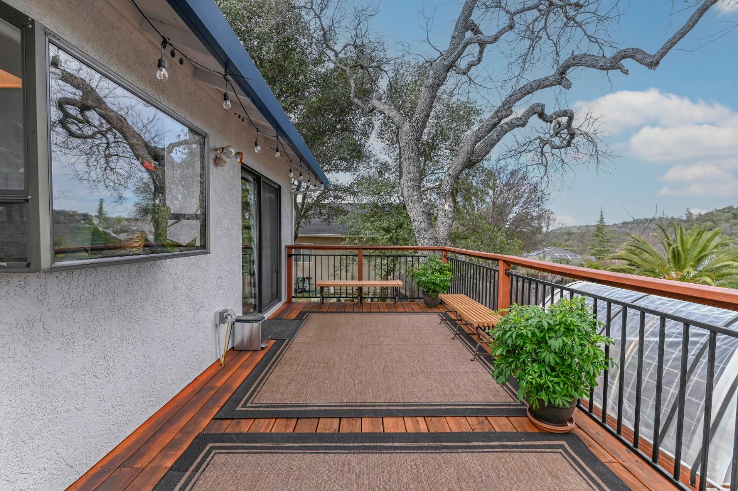 147 Rocky Ridge Lane Angels Camp, CA 95222 - Photo 14 of 61 a view of balcony with wooden floor and fence