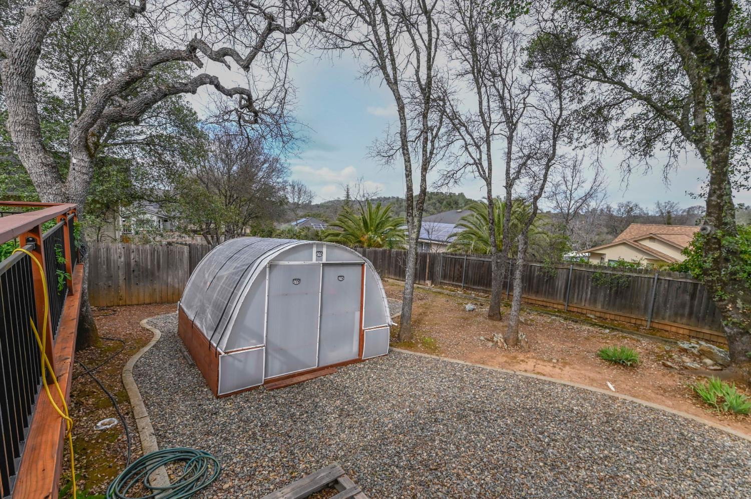 147 Rocky Ridge Lane Angels Camp, CA 95222 - Photo 15 of 61 a backyard of a house with barbeque oven table and chairs