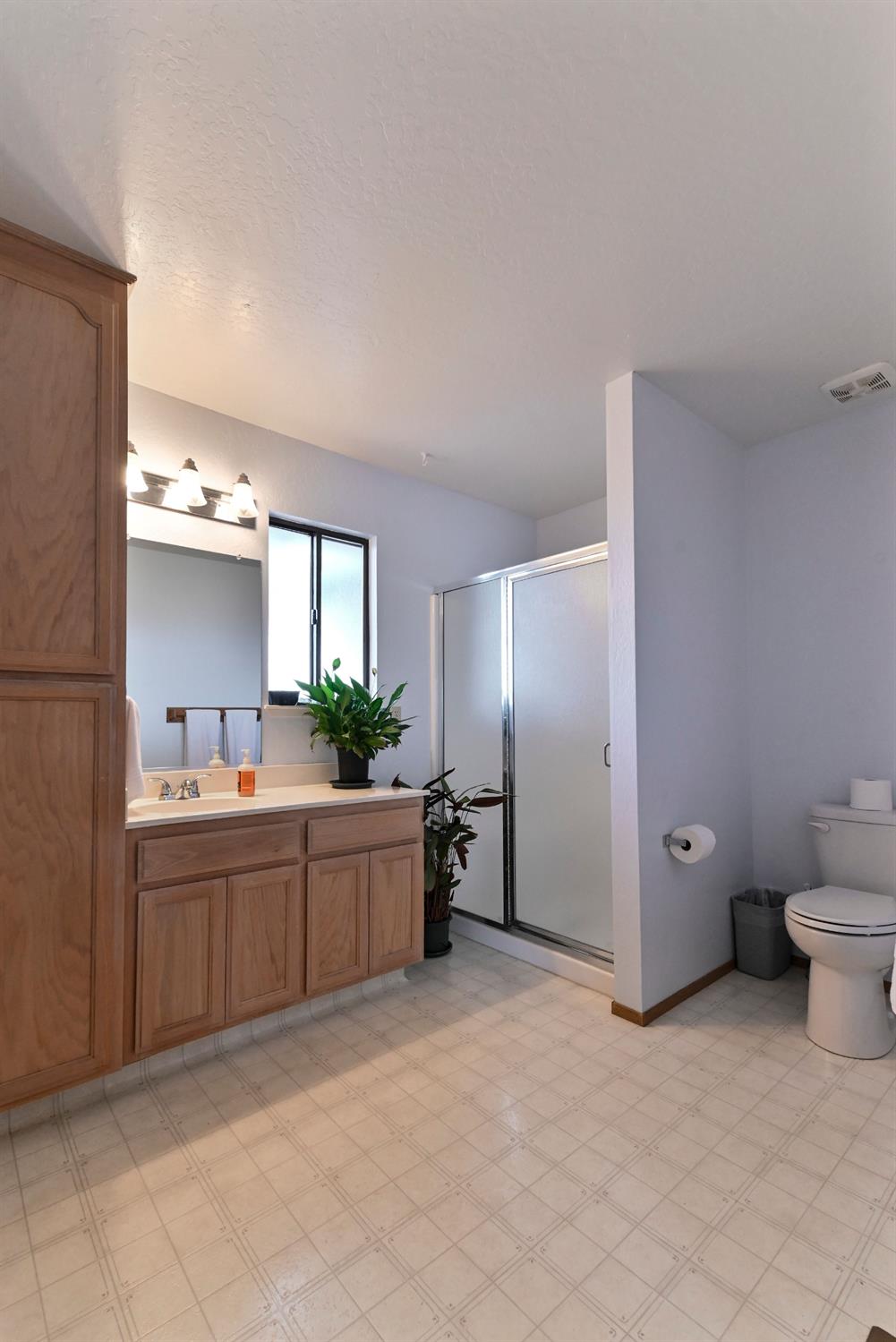 147 Rocky Ridge Lane Angels Camp, CA 95222 - Photo 25 of 61 a large bathroom with a sink and mirror