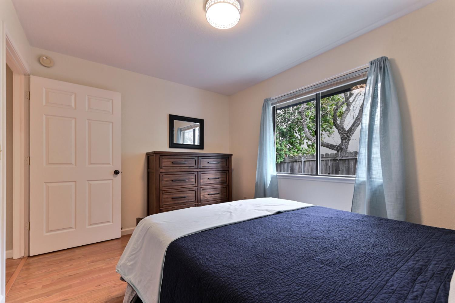 147 Rocky Ridge Lane Angels Camp, CA 95222 - Photo 35 of 61 a bedroom with a bed and a window