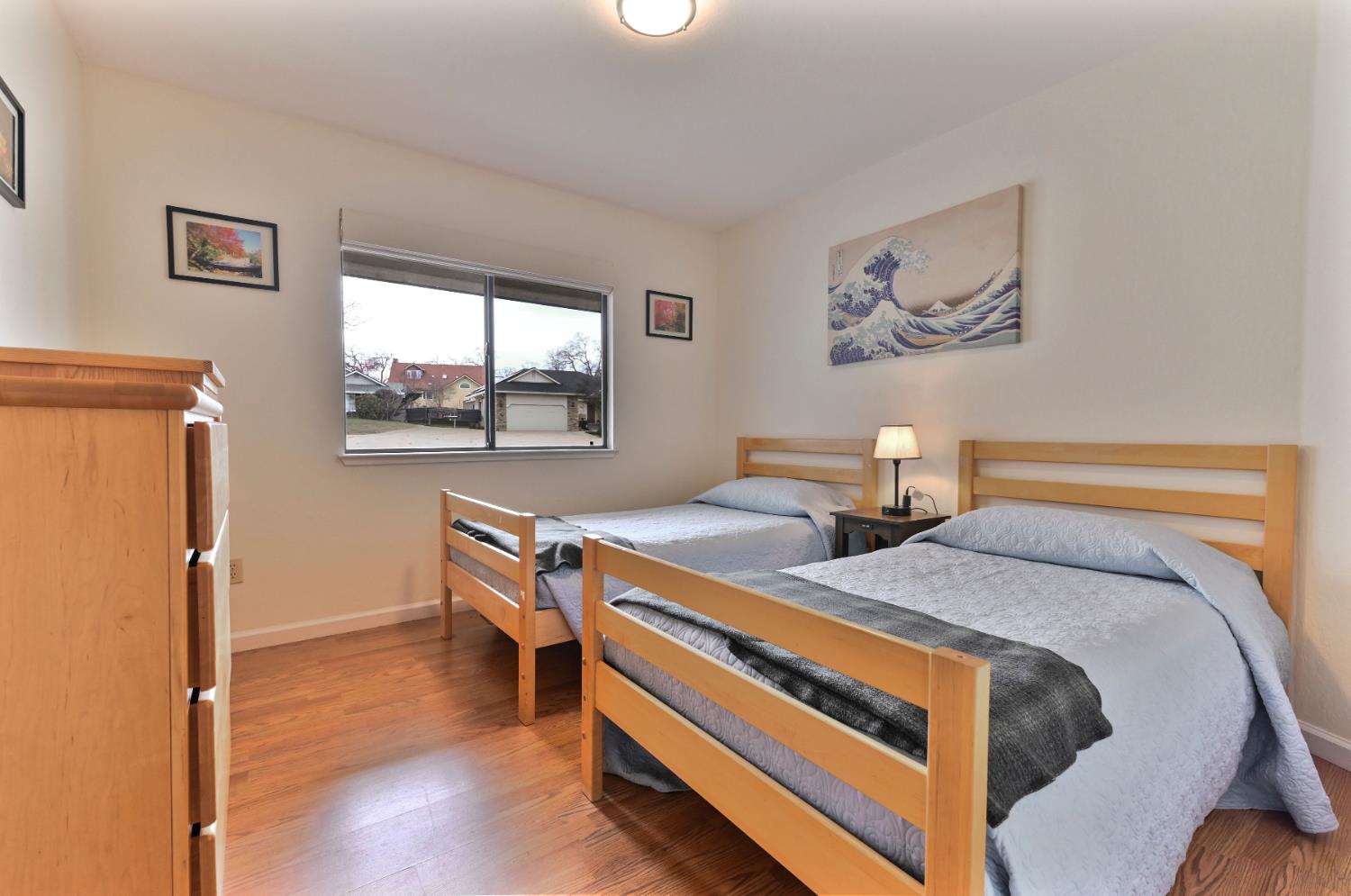 147 Rocky Ridge Lane Angels Camp, CA 95222 - Photo 37 of 61 a bedroom with two beds and a window