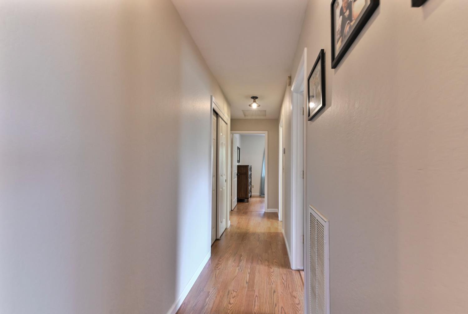 147 Rocky Ridge Lane Angels Camp, CA 95222 - Photo 39 of 61 a view of a hallway with wooden floor