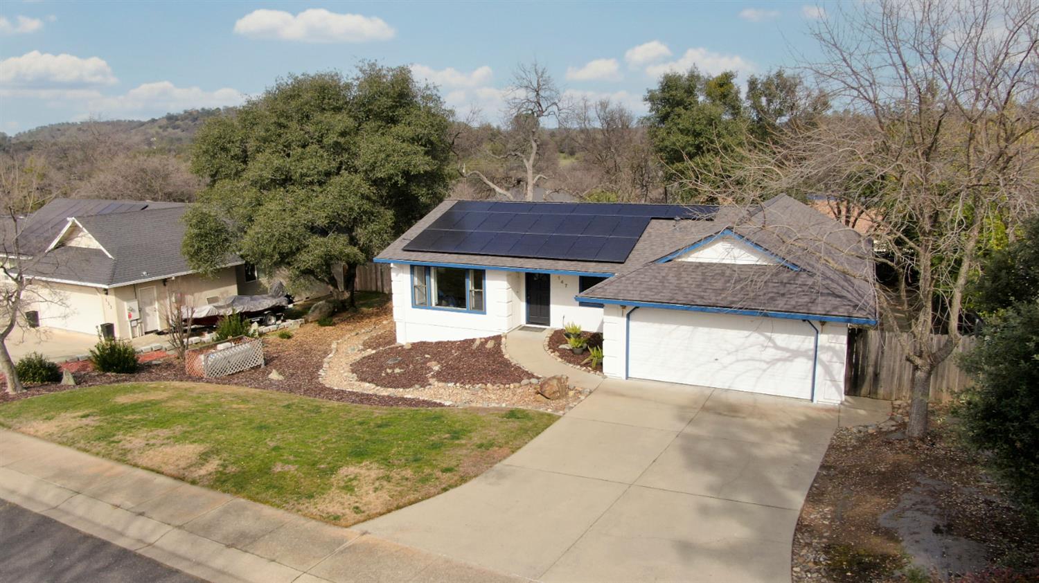 147 Rocky Ridge Lane Angels Camp, CA 95222 - Photo 4 of 61 a front view of a house with garden