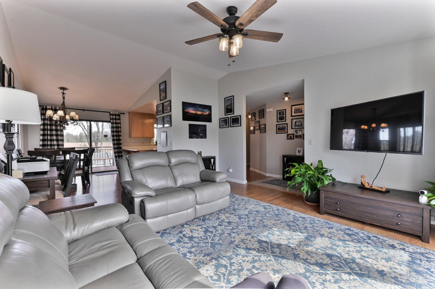 147 Rocky Ridge Lane Angels Camp, CA 95222 - Photo 46 of 61 a living room with furniture and a flat screen tv