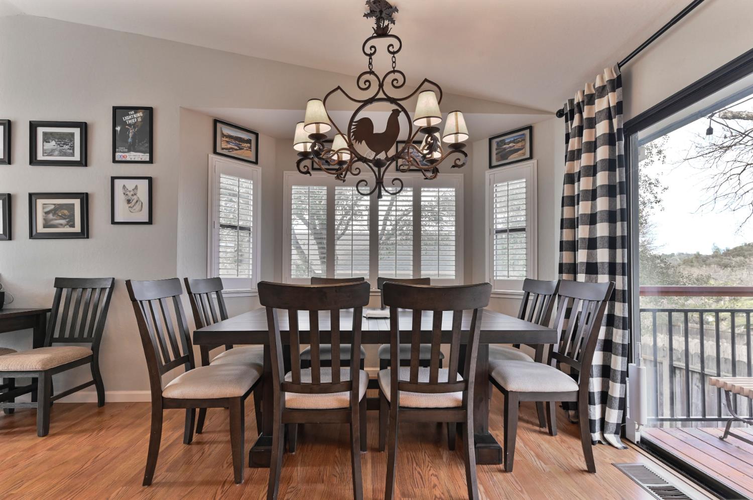 147 Rocky Ridge Lane Angels Camp, CA 95222 - Photo 48 of 61 a view of a dining room with furniture wooden floor and chandelier