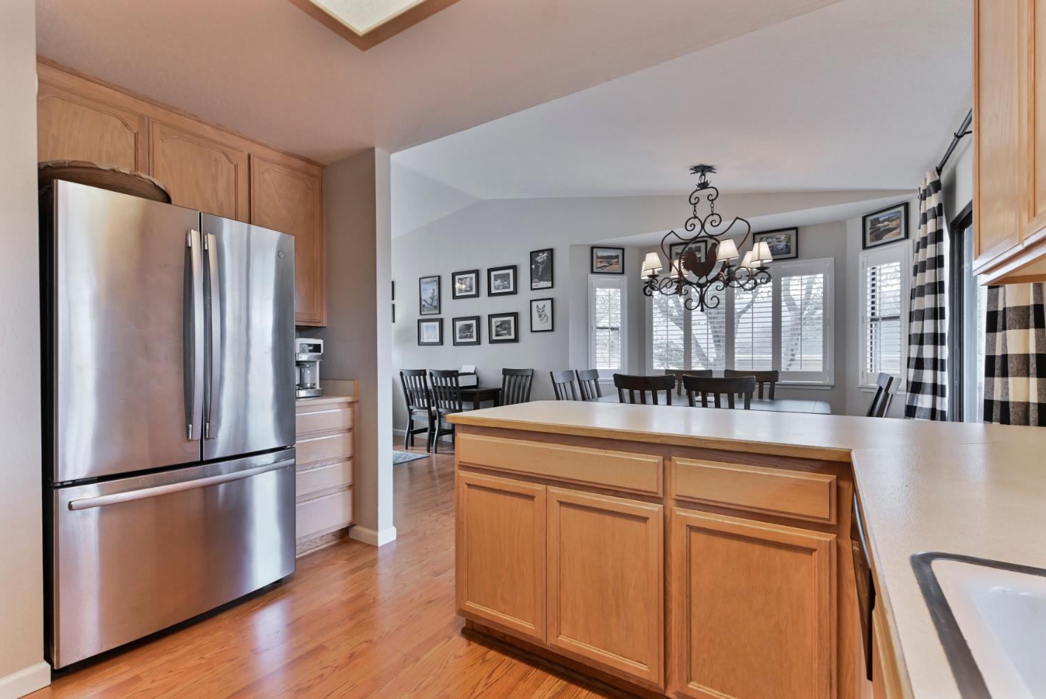 147 Rocky Ridge Lane Angels Camp, CA 95222 - Photo 54 of 61 a kitchen with cabinets and stainless steel appliances