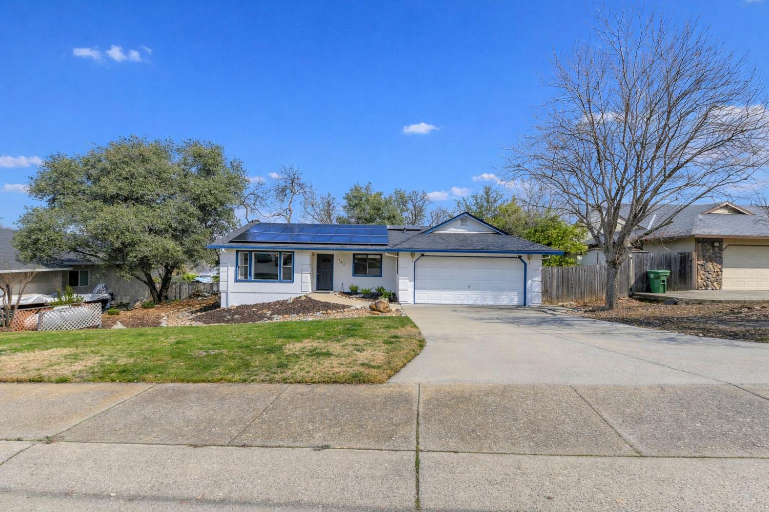147 Rocky Ridge Lane Angels Camp, CA 95222 - Photo 57 of 61 a front view of a house with a garden and tree