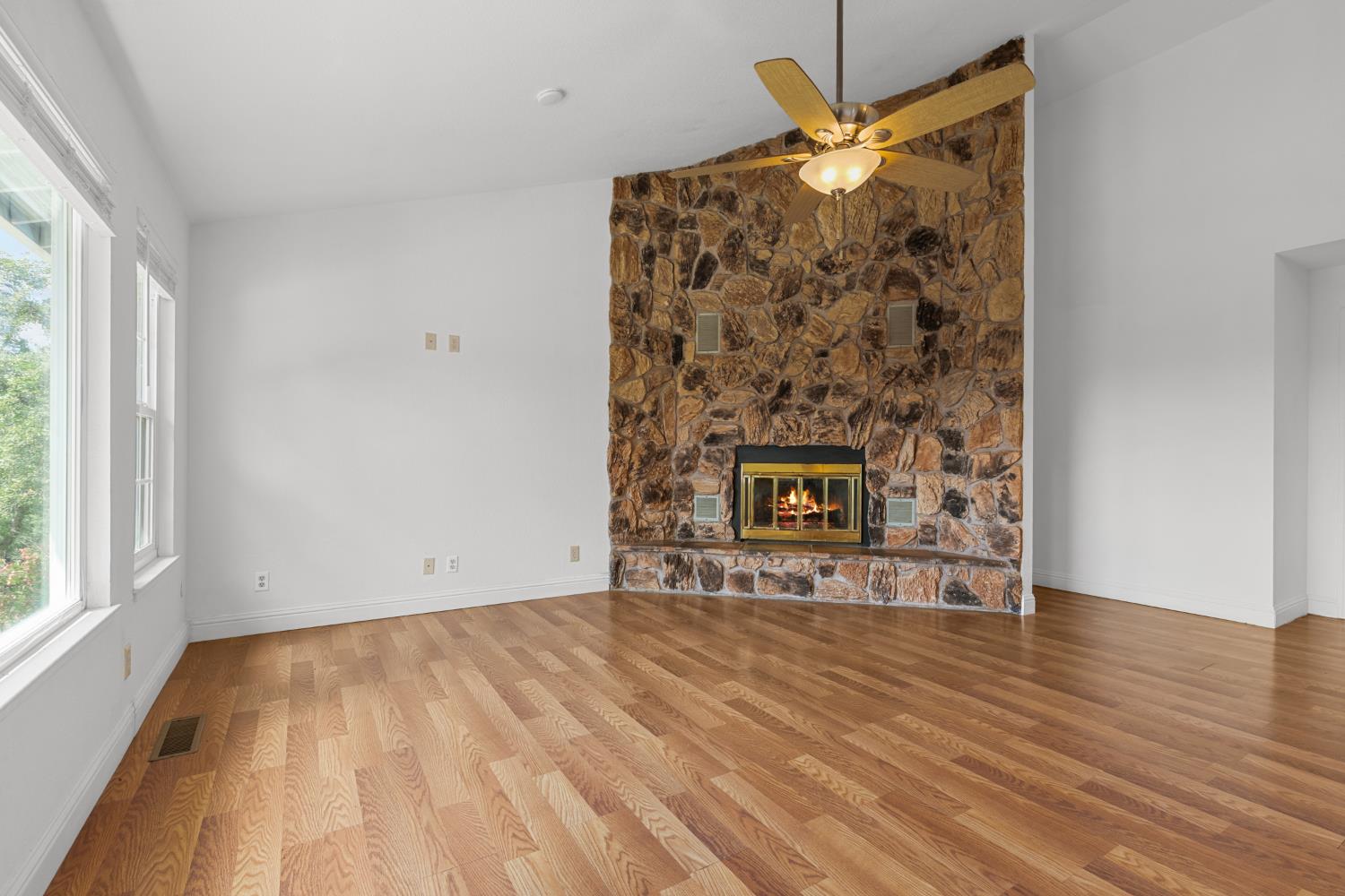 8310 Crotty Way Valley Springs, CA 95252 - Photo 10 of 61 Fire is digitally staged. New flooring in the living room.
