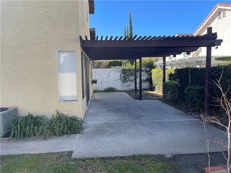 8 Marsh Hawk Irvine, CA 92604 - Photo 11 of 13 a view of a patio with a table and chairs next to a yard