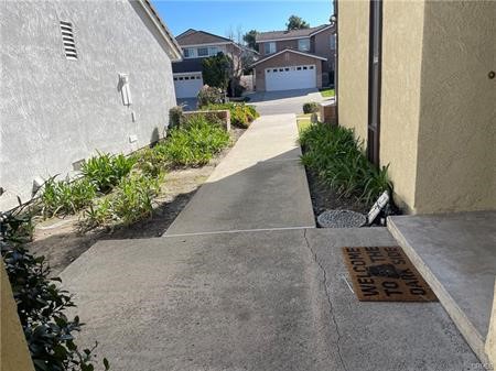 8 Marsh Hawk Irvine, CA 92604 - Photo 12 of 13 a view of a street with potted plants