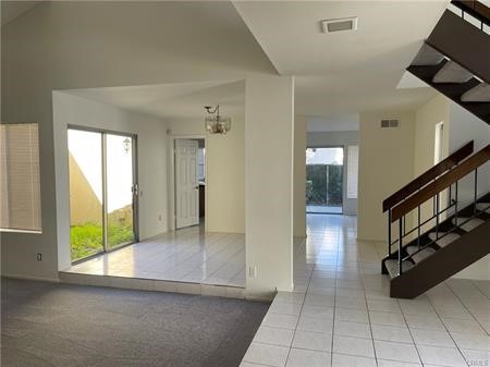 8 Marsh Hawk Irvine, CA 92604 - Photo 4 of 13 a view of a hallway view with staircase