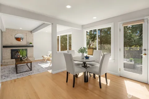 a view of a dining room with furniture window and wooden floor