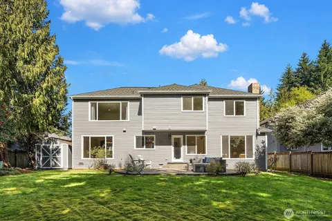 a view of house with yard