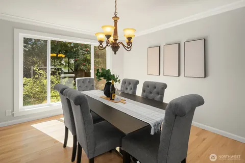 a view of a dining room with furniture window and outside view