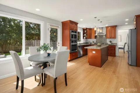 a view of a dining room with furniture window and outside view