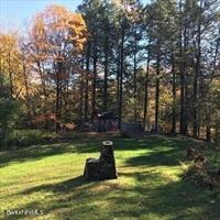 320 East River Road Chester, MA 01011 - Photo 18 of 34 a swimming pool with wooden fence