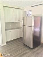 320 East River Road Chester, MA 01011 - Photo 27 of 34 a white refrigerator freezer sitting in a kitchen