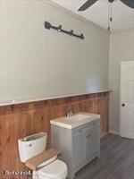 320 East River Road Chester, MA 01011 - Photo 30 of 34 a bathroom with a toilet a sink and mirror