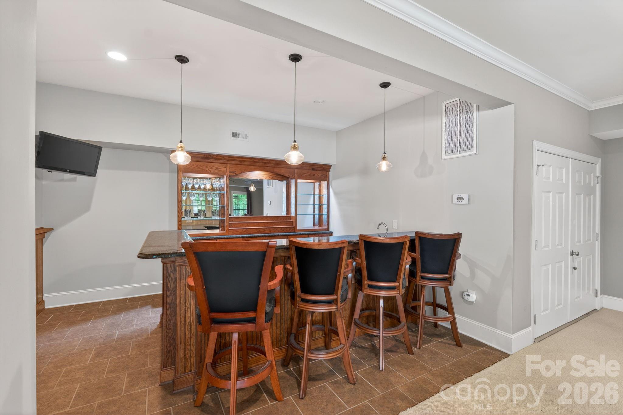3138 Rappahannock Court, Unit 16 Matthews, NC 28104 - Photo 30 of 38 a dining room with furniture and window