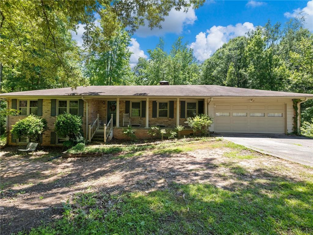 2757 River Road Ellenwood, GA 30294 - Photo 1 of 1 a view of a house with backyard and garden
