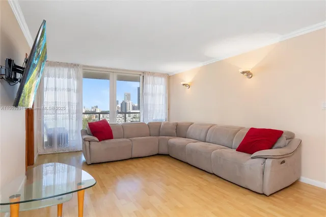 a living room with furniture and a flat screen tv