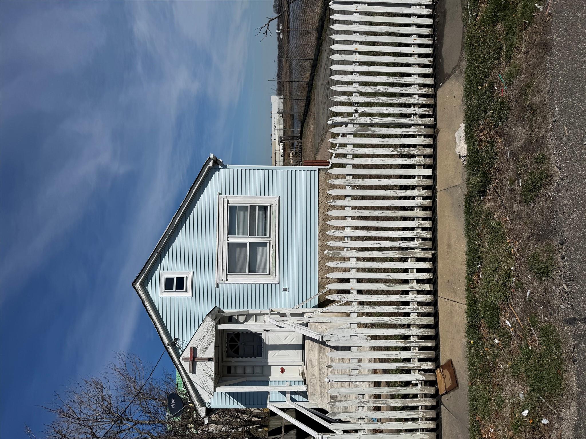 View of front of house with a fenced front yard