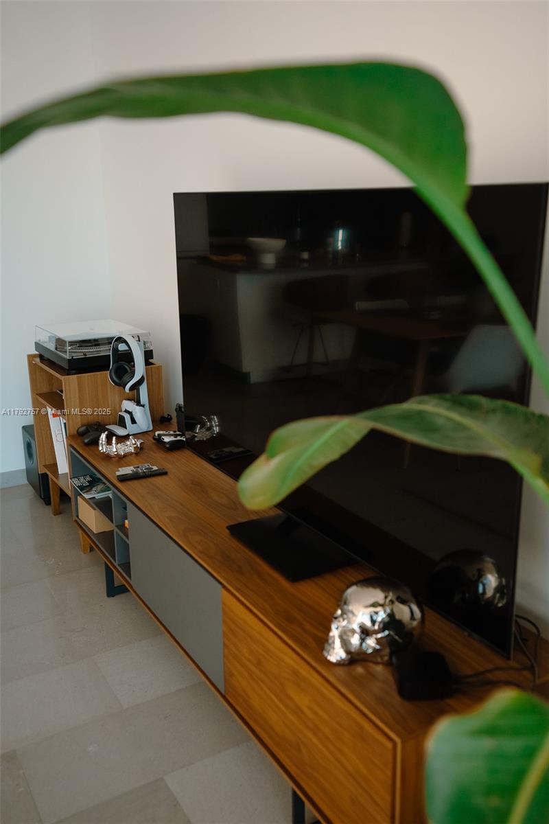 68 Southeast 6th Street, Unit 1204 Miami, FL 33131 - Photo 20 of 48 a living room with furniture and a fireplace