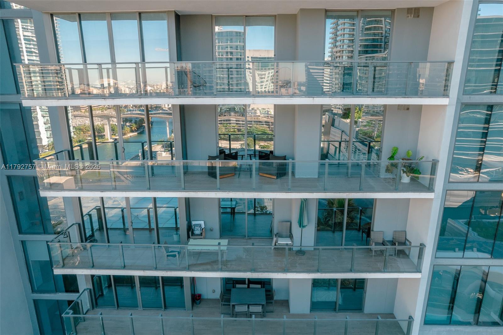 68 Southeast 6th Street, Unit 1204 Miami, FL 33131 - Photo 40 of 48 a view of a dining room with a table and chairs