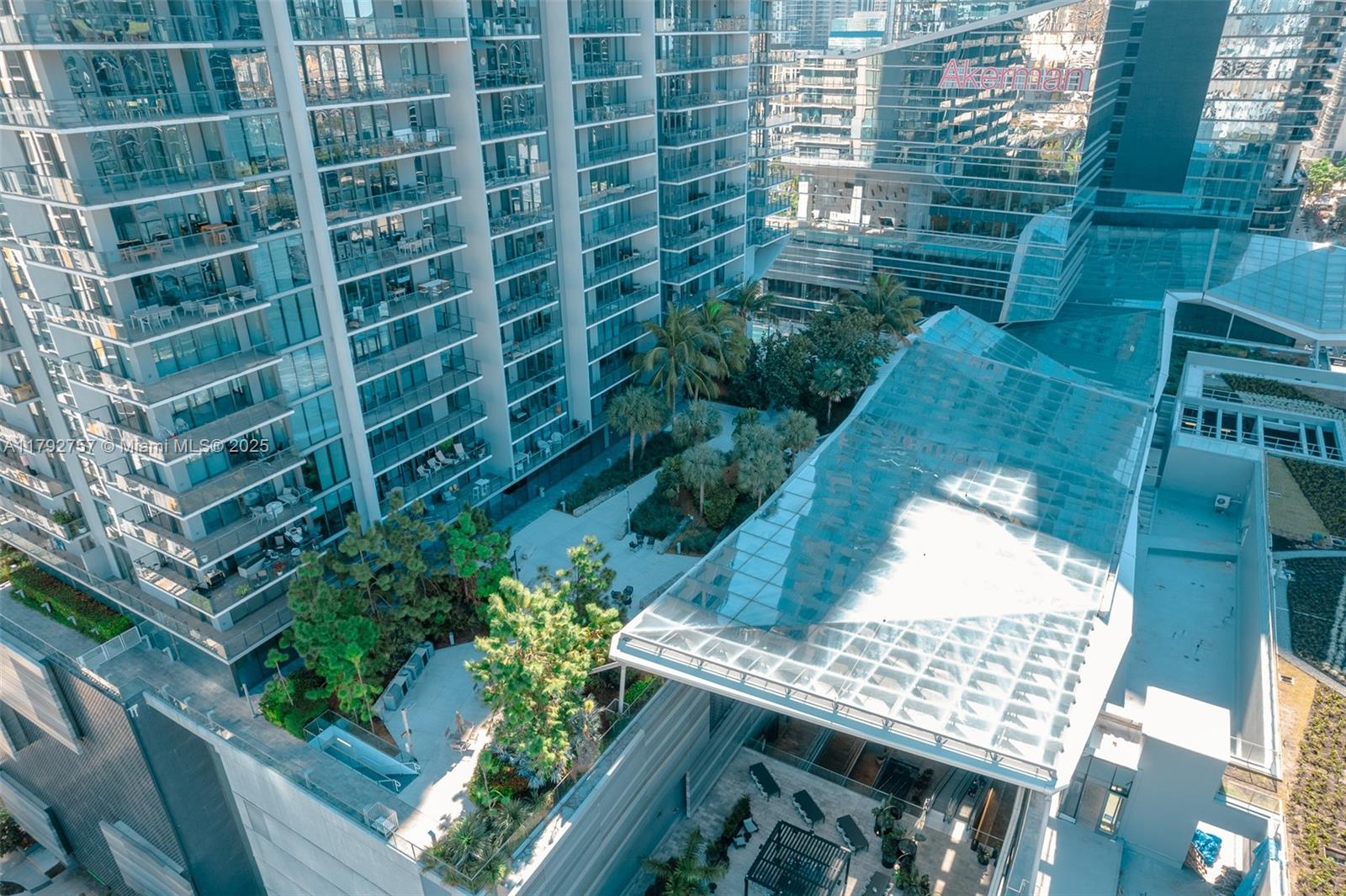 68 Southeast 6th Street, Unit 1204 Miami, FL 33131 - Photo 41 of 48 a view of a balcony with wooden floor and plants