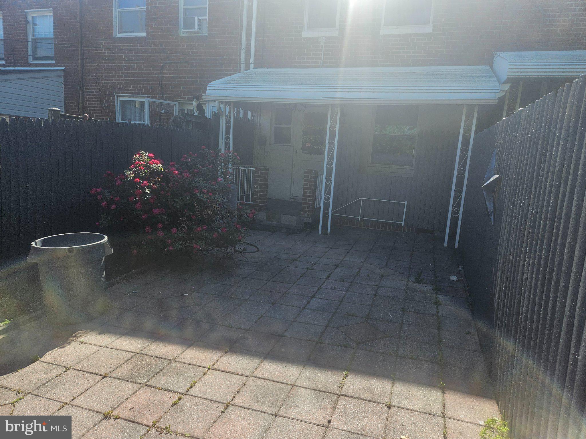 635 48th Street Baltimore, MD 21224 - Photo 13 of 14 Charming patio with blooming roses.