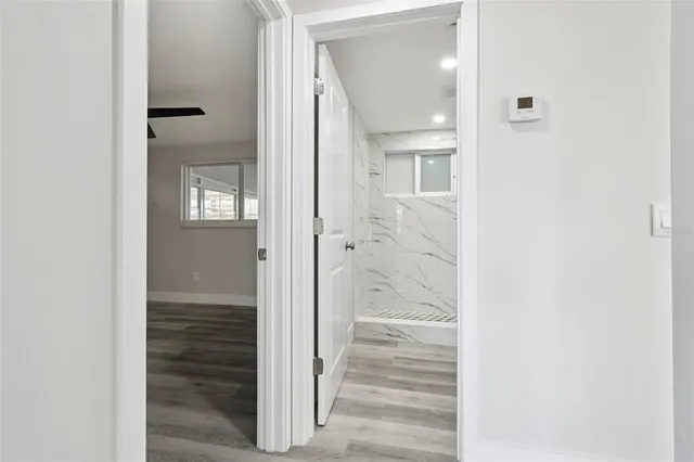 a view of an empty room with a window