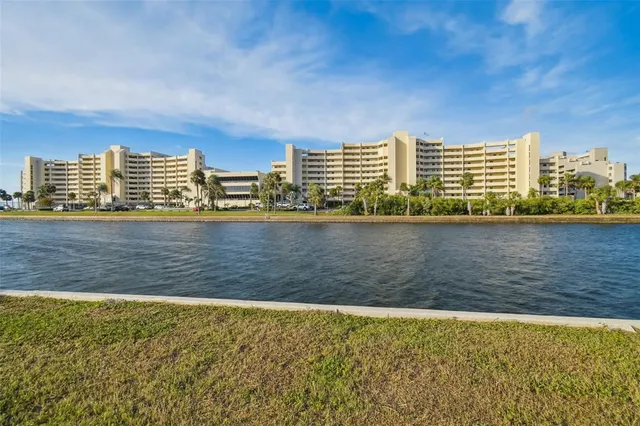 a view of swimming pool with outdoor seating and city view