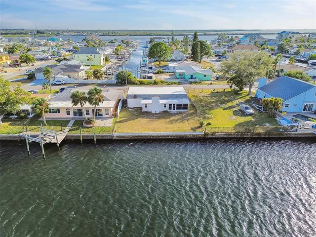 an aerial view of a house with outdoor space