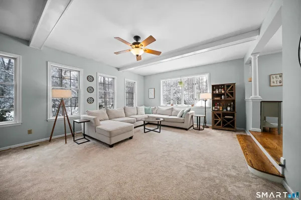 a living room with furniture and a fireplace