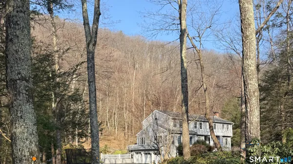 a front view of a residential apartment building with a yard
