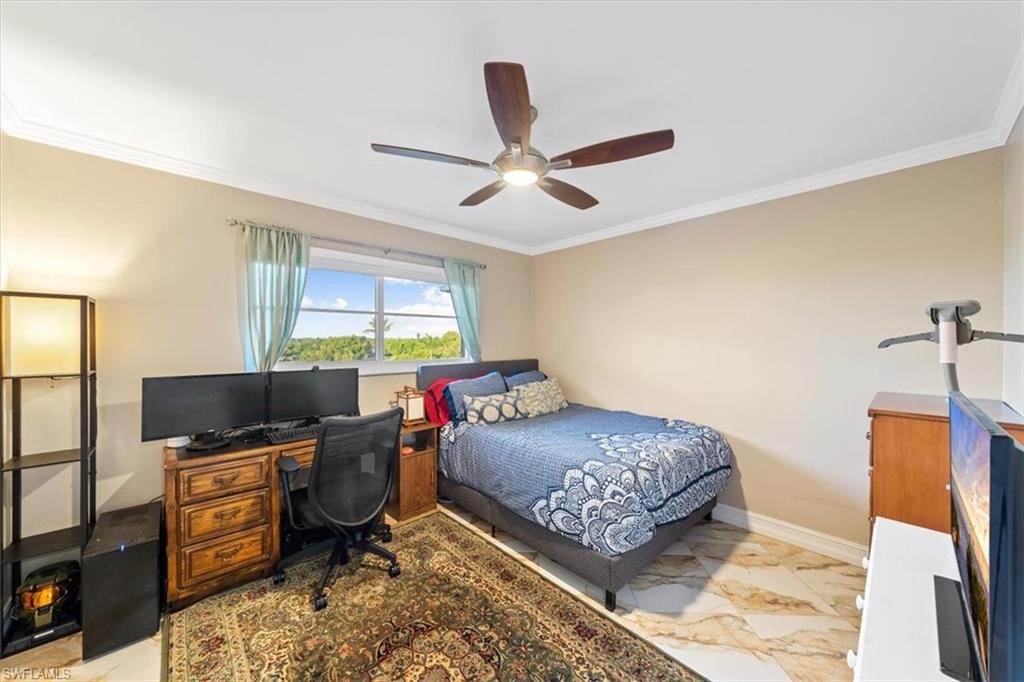 190 Pebble Beach Boulevard, Unit 502 Naples, FL 34113 - Photo 19 of 27 a bedroom with a workspace
